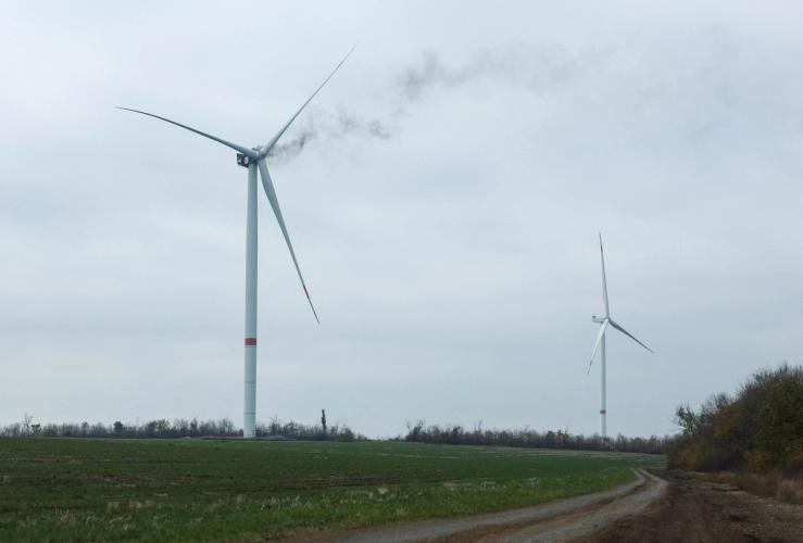 Smoke rises from a power-generating wind turbine hit by a Russian drone strike, amid Russia’s ongoing attack on Ukraine, near Kramatorsk in the Donetsk region, Ukraine, October 24, 2025.