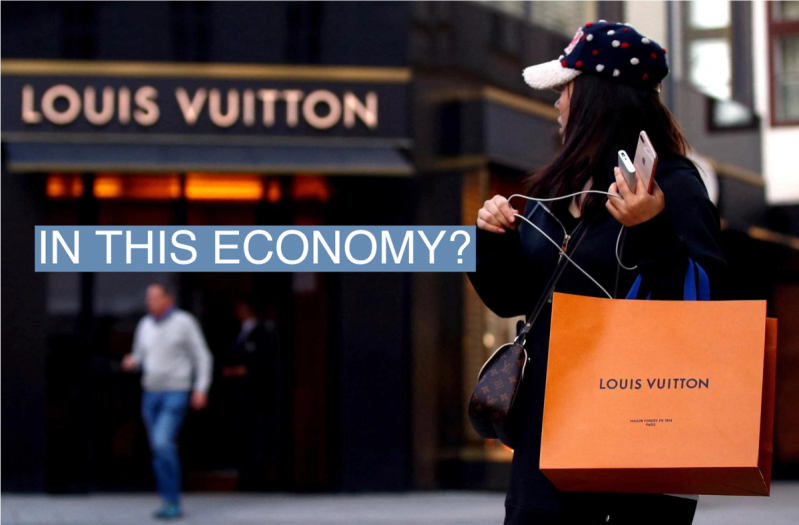 A woman with a Louis Vuitton-branded shopping bag in Vienna.