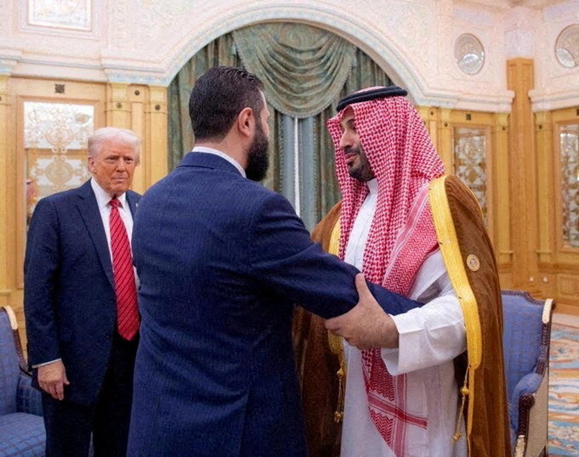 Syrian President Ahmed al-Sharaa meets with U.S. President Donald Trump and Saudi Crown Prince Mohammed Bin Salman in Riyadh, Saudi Arabia, in this handout released on May 14, 2025.