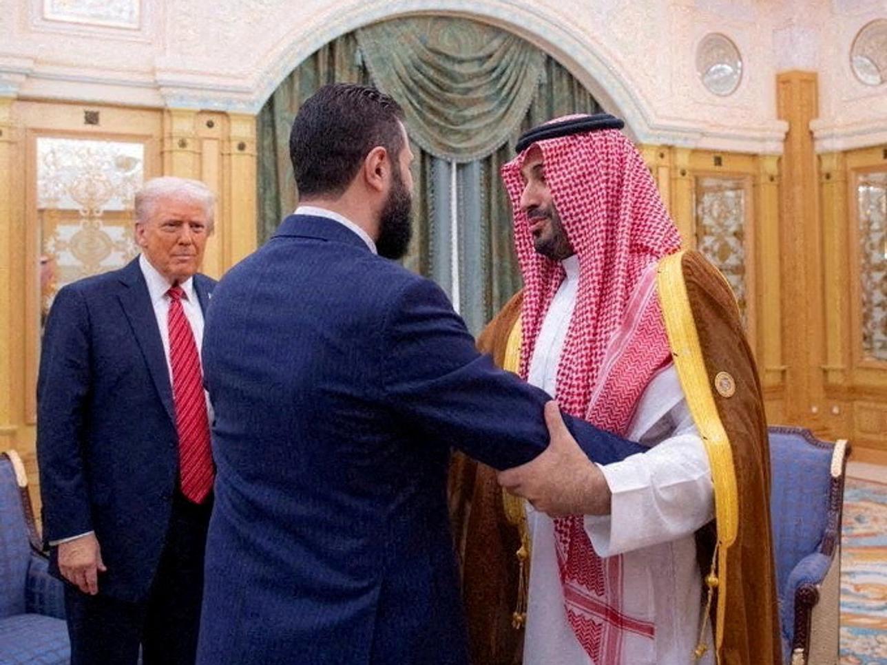 Syrian President Ahmed al-Sharaa meets with U.S. President Donald Trump and Saudi Crown Prince Mohammed Bin Salman in Riyadh, Saudi Arabia, in this handout released on May 14, 2025.