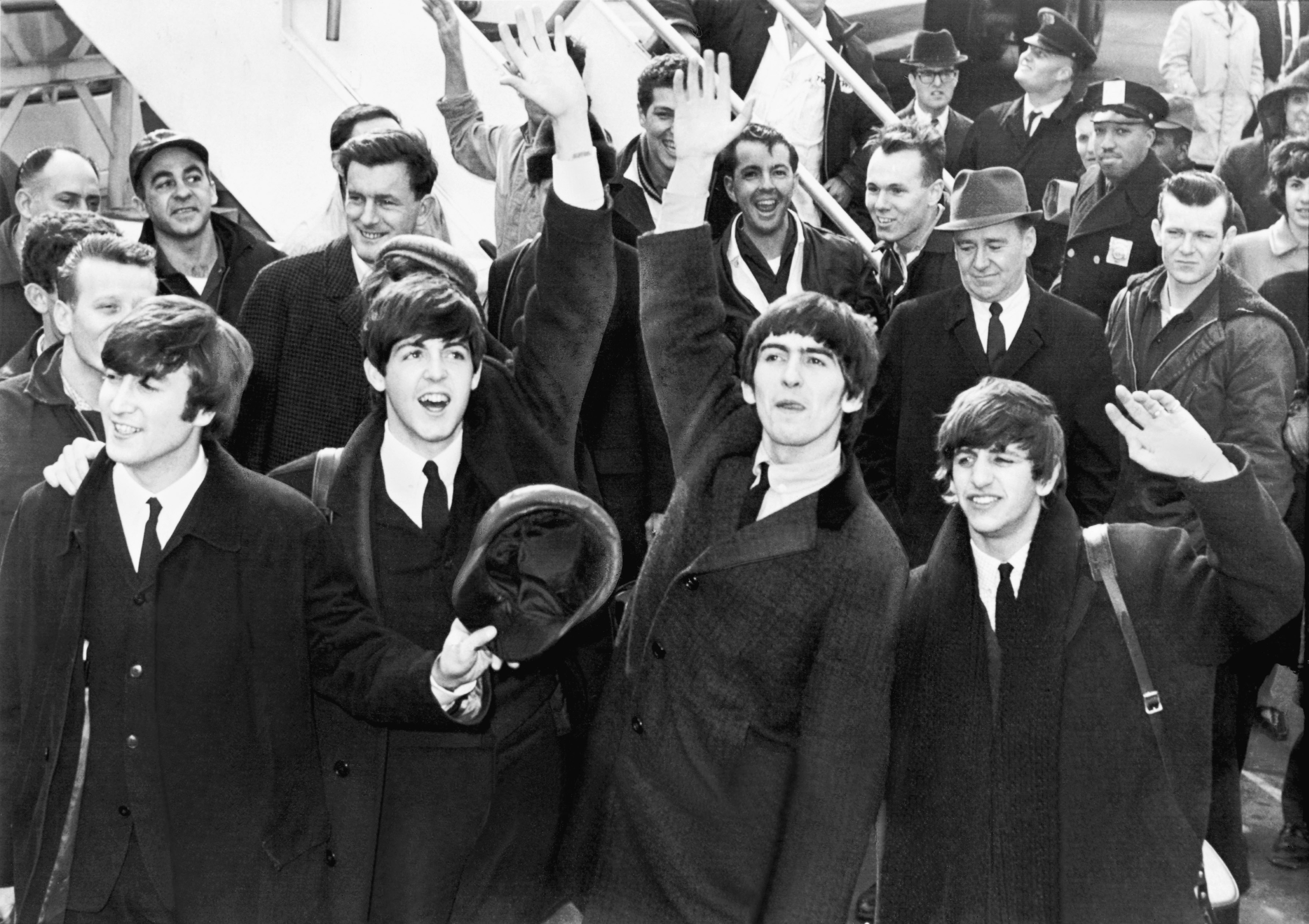 A black and white photo of the Beatles.