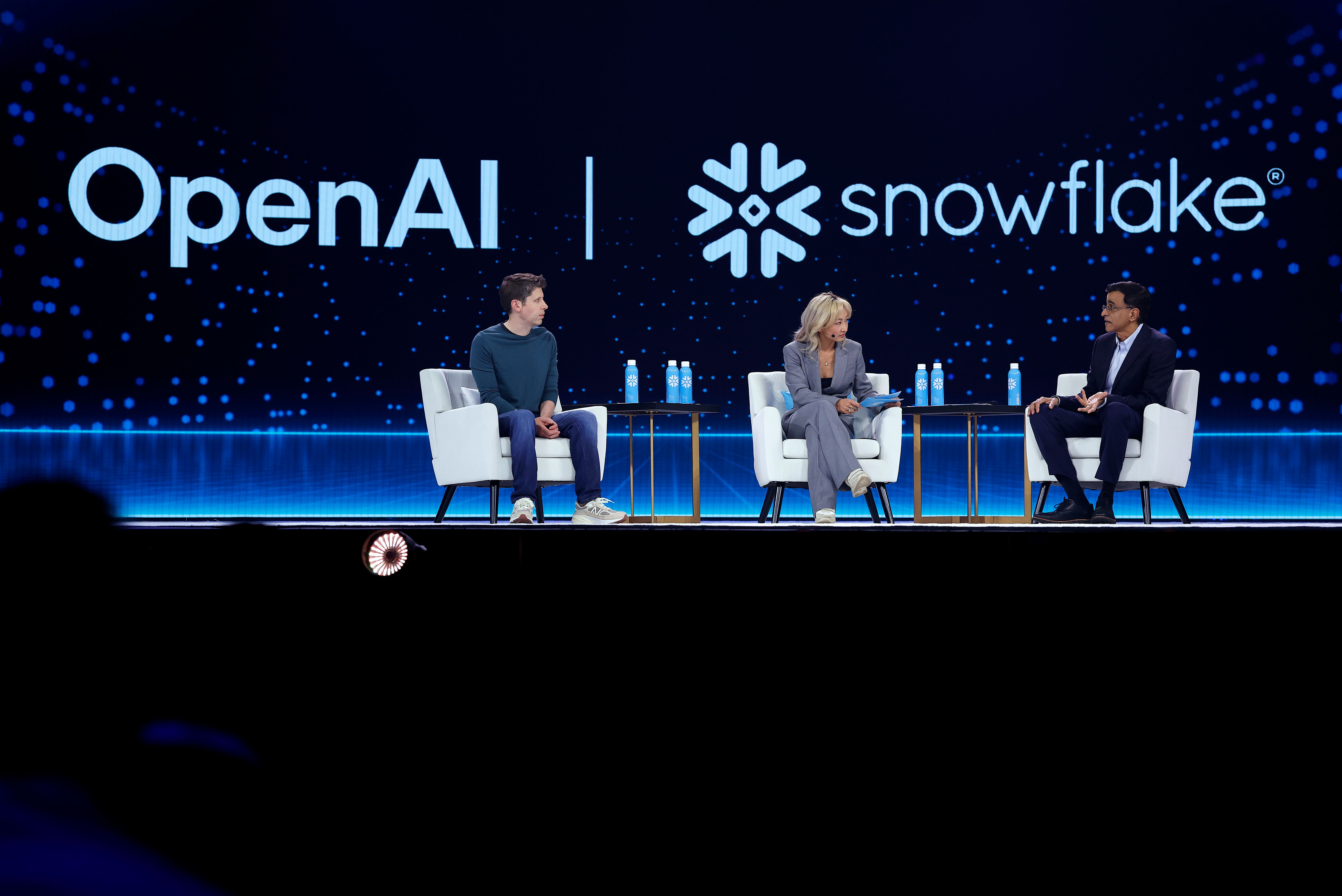 Snowflake CEO Sridhar Ramaswamy (R) speaks in conversation with Sarah Guo (C) and Open AI CEO Sam Altman (L) .