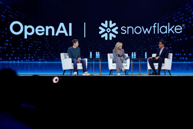 Snowflake CEO Sridhar Ramaswamy (R) speaks in conversation with Sarah Guo (C) and Open AI CEO Sam Altman (L) .