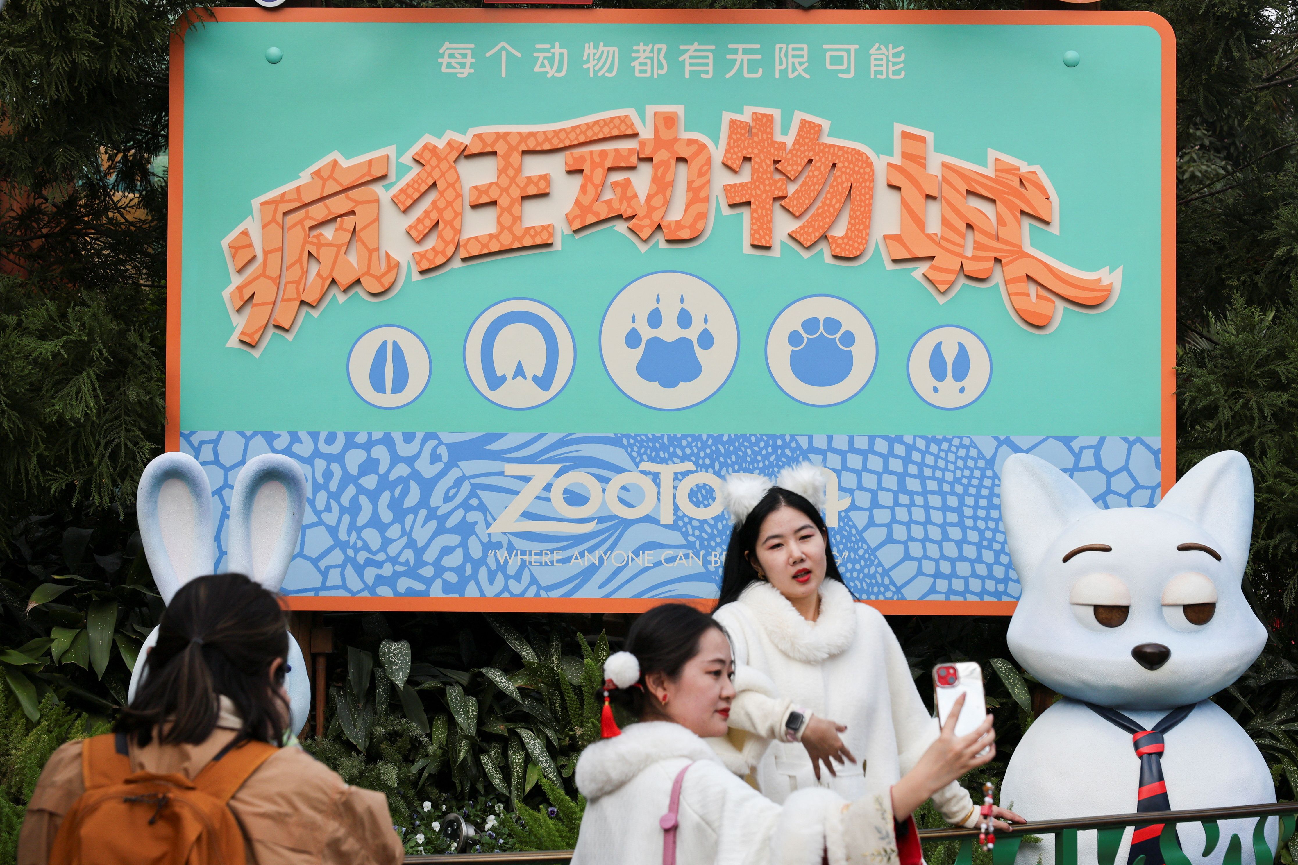 Visitors to Shanghai Disneyland enjoy a Zootopia display