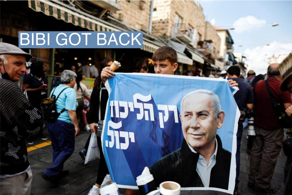 A Netanyahu supporter holds up an election banner