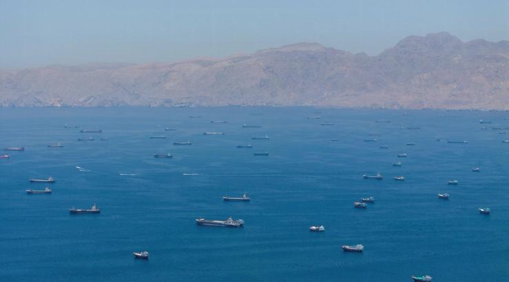 A drone view shows vessels anchored at the Strait of Hormuz.