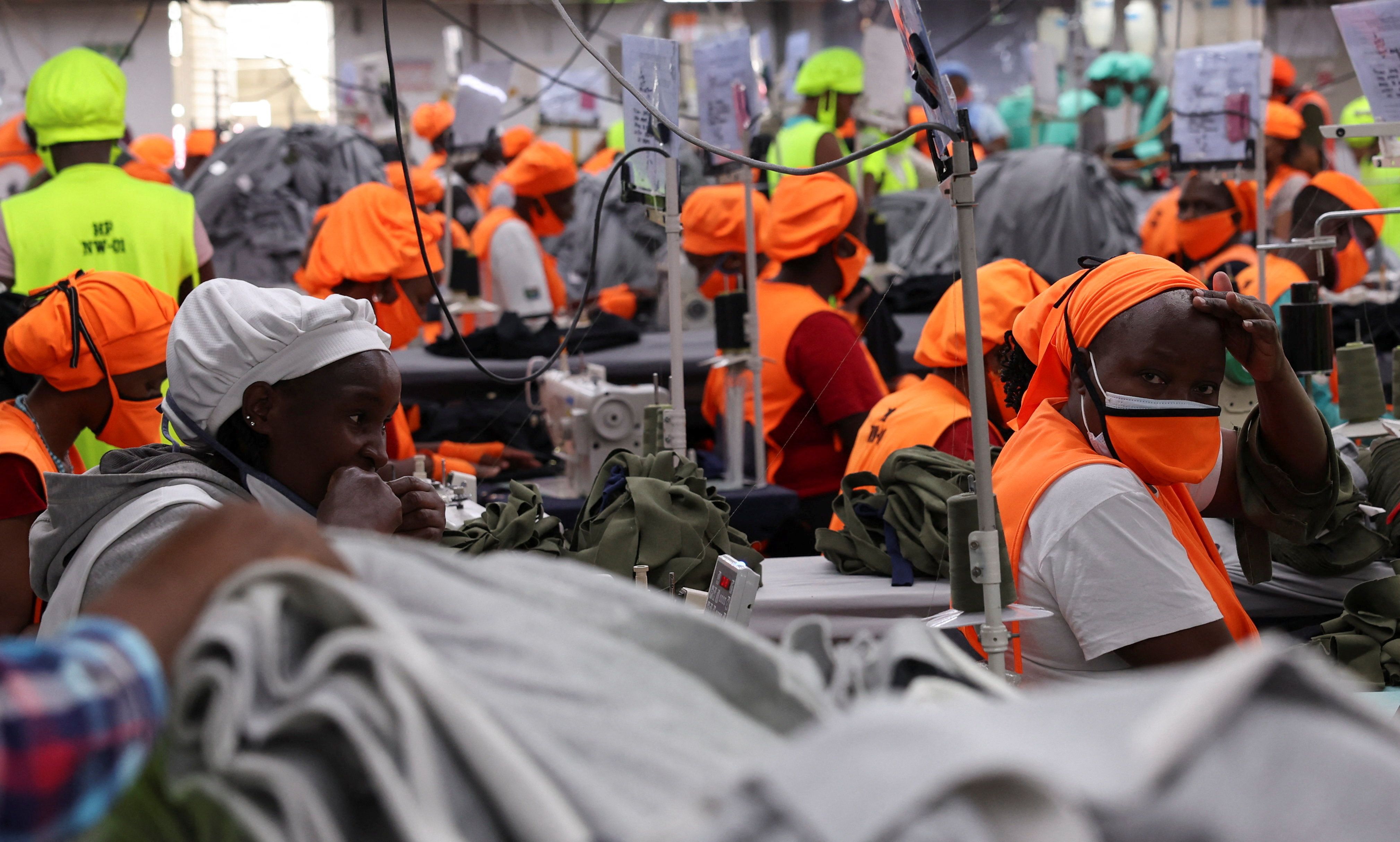 Kenyan workers prepare clothes for export at a factory.