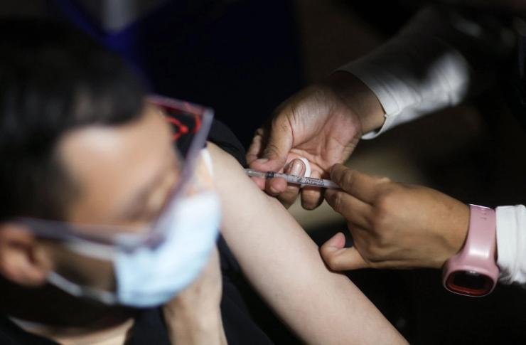 A person getting vaccinated.