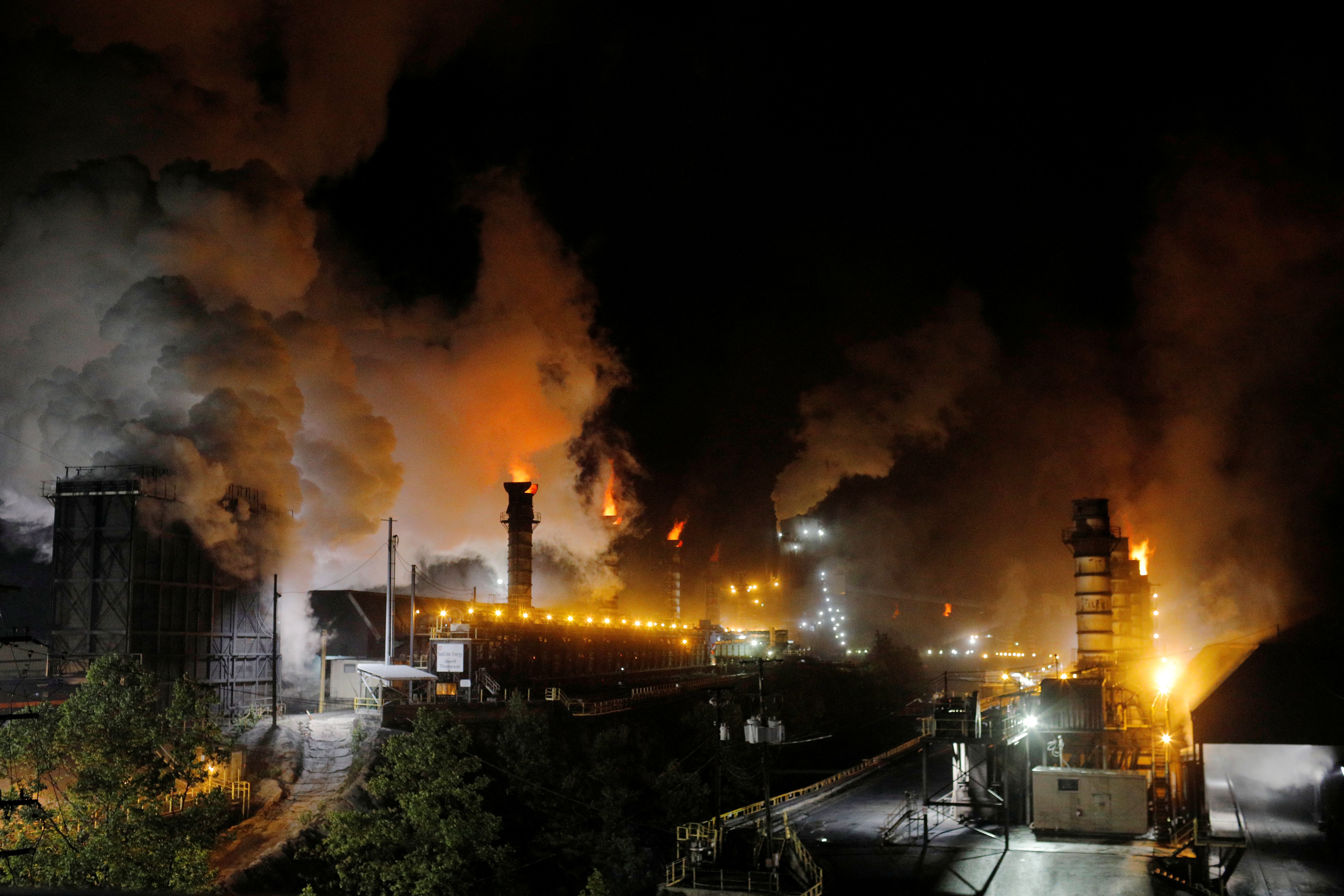 Flames and steam rise from the Suncoke Jewell cokemaking plant, which burns coal to make coke in Virginia.