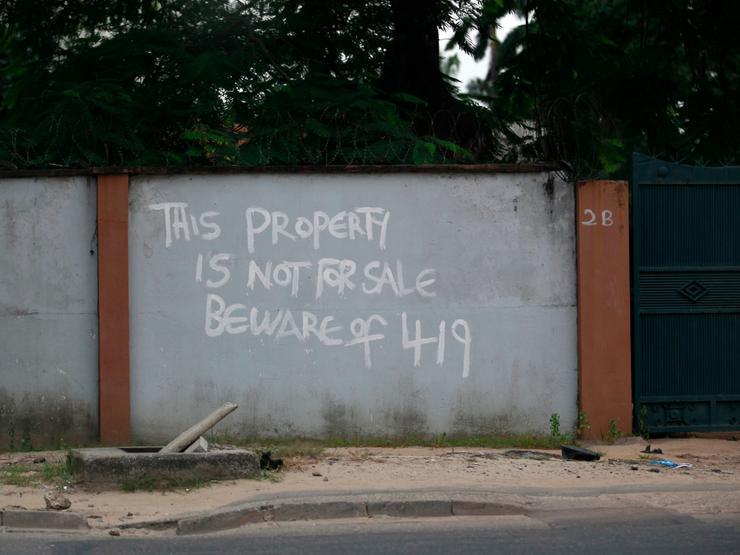 A warning painted on a house in Lagos referring to a popular property scam.