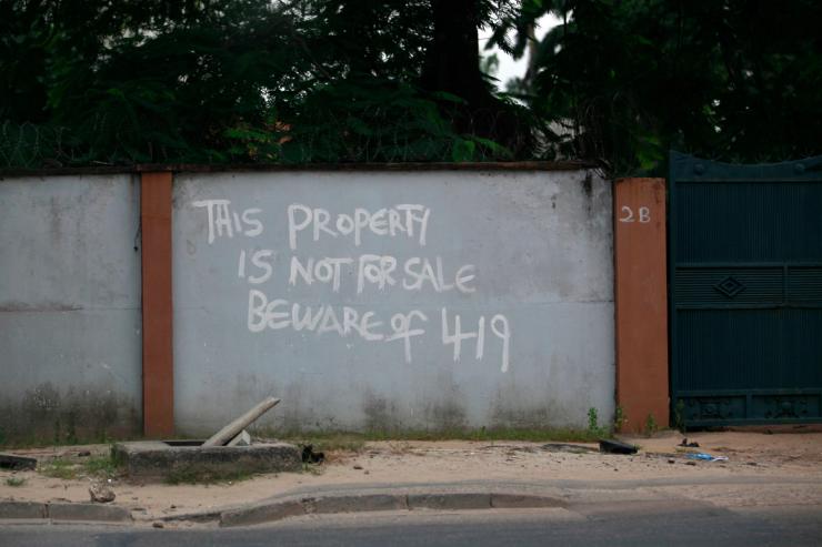 A warning painted on a house in Lagos referring to a popular property scam.