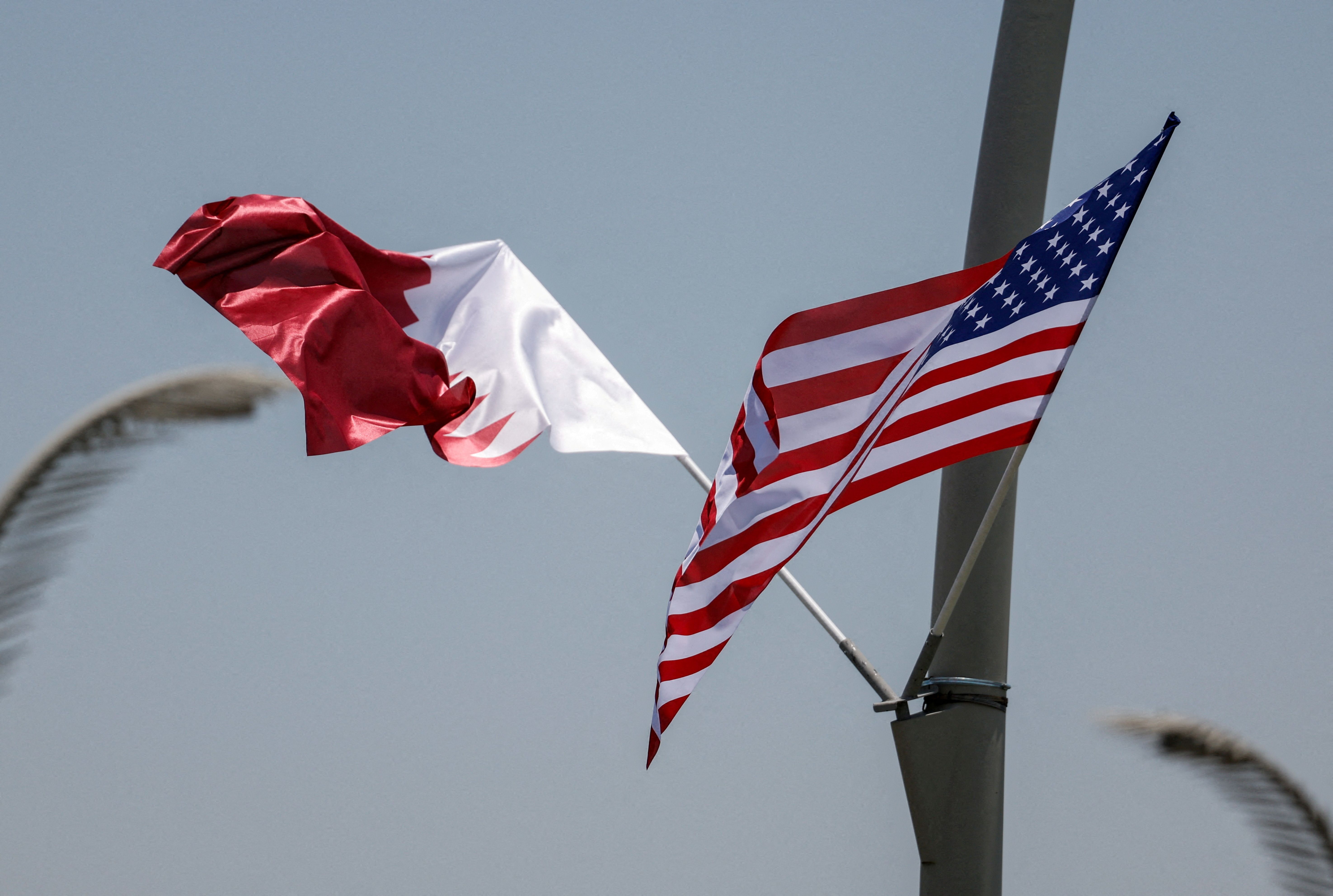 US and Qatari flags