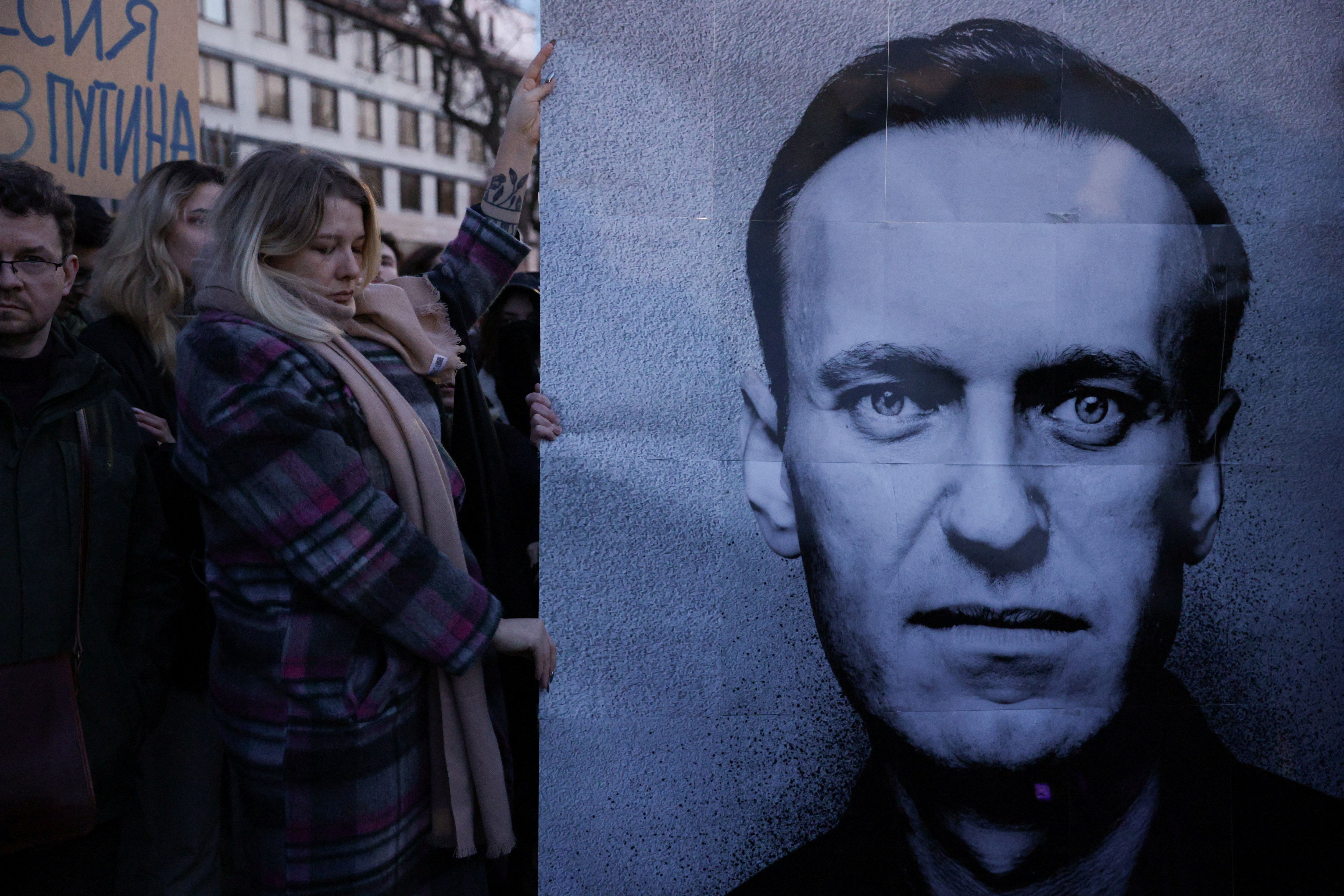 People gather outside the Russian embassy, following the death of Russian opposition leader Alexei Navalny, reported by prison authorities in Russia’s Yamalo-Nenets region where he had been serving his sentence, in Warsaw, Poland, February 16, 2024. Dawid Zuchowicz/Agencja Wyborcza.pl via REUTERS