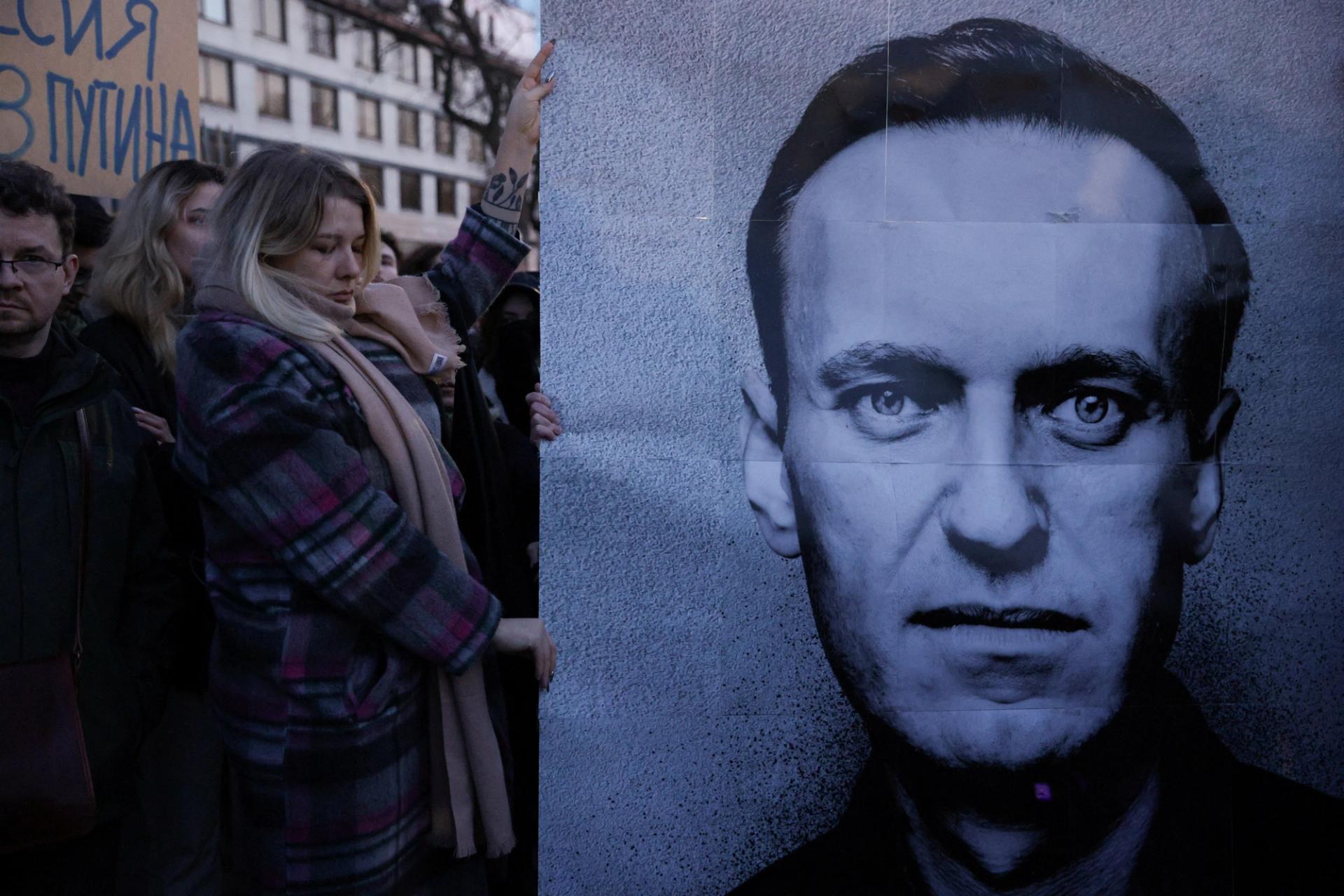 People gather outside the Russian embassy, following the death of Russian opposition leader Alexei Navalny, reported by prison authorities in Russia's Yamalo-Nenets region where he had been serving his sentence, in Warsaw, Poland, February 16, 2024. Dawid Zuchowicz/Agencja Wyborcza.pl via REUTERS