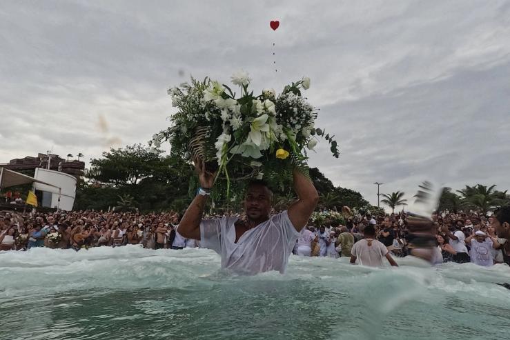 A worshipper takes part in another Iemanjá ceremony on a beach in Rio de Janeiro.
