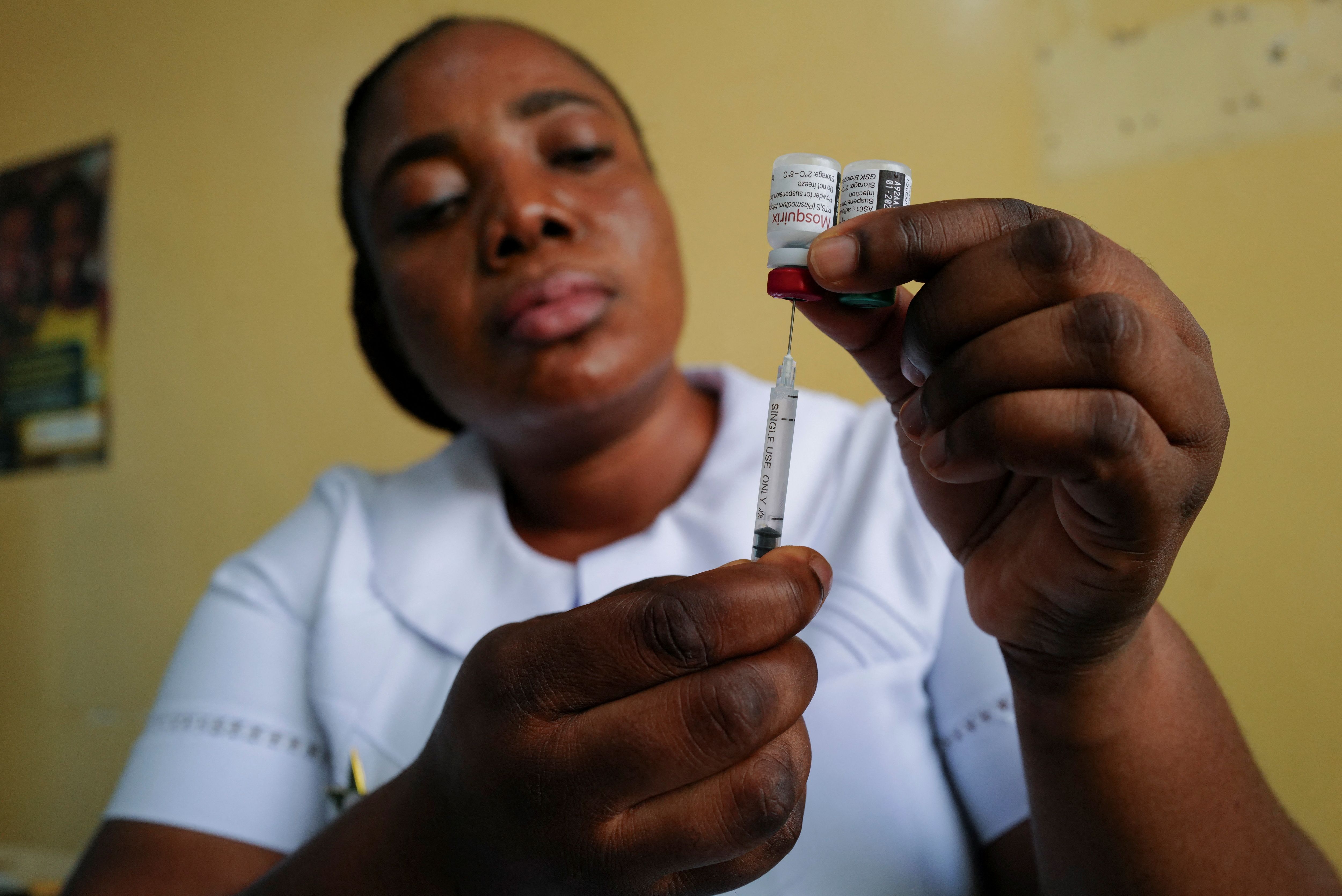 Nurse Bernice Kabutey prepares to administer a dose of the RTS,S malaria vaccine.