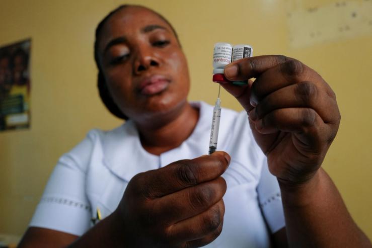 Nurse Bernice Kabutey prepares to administer a dose of the RTS,S malaria vaccine.