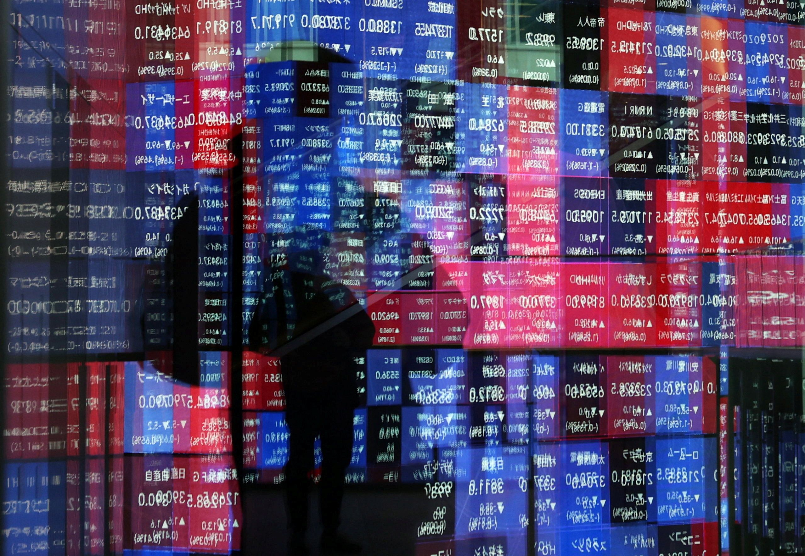 Reflection of a stock quotation board in Tokyo, Japan