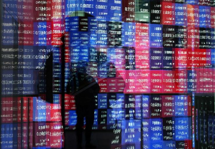 Reflection of a stock quotation board in Tokyo, Japan