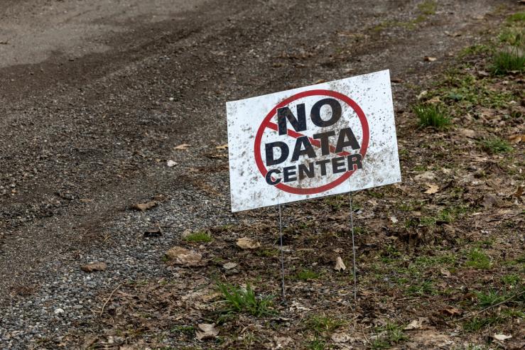 A sign that reads “No data center” sits outside a home in New Carlisle, Indiana.