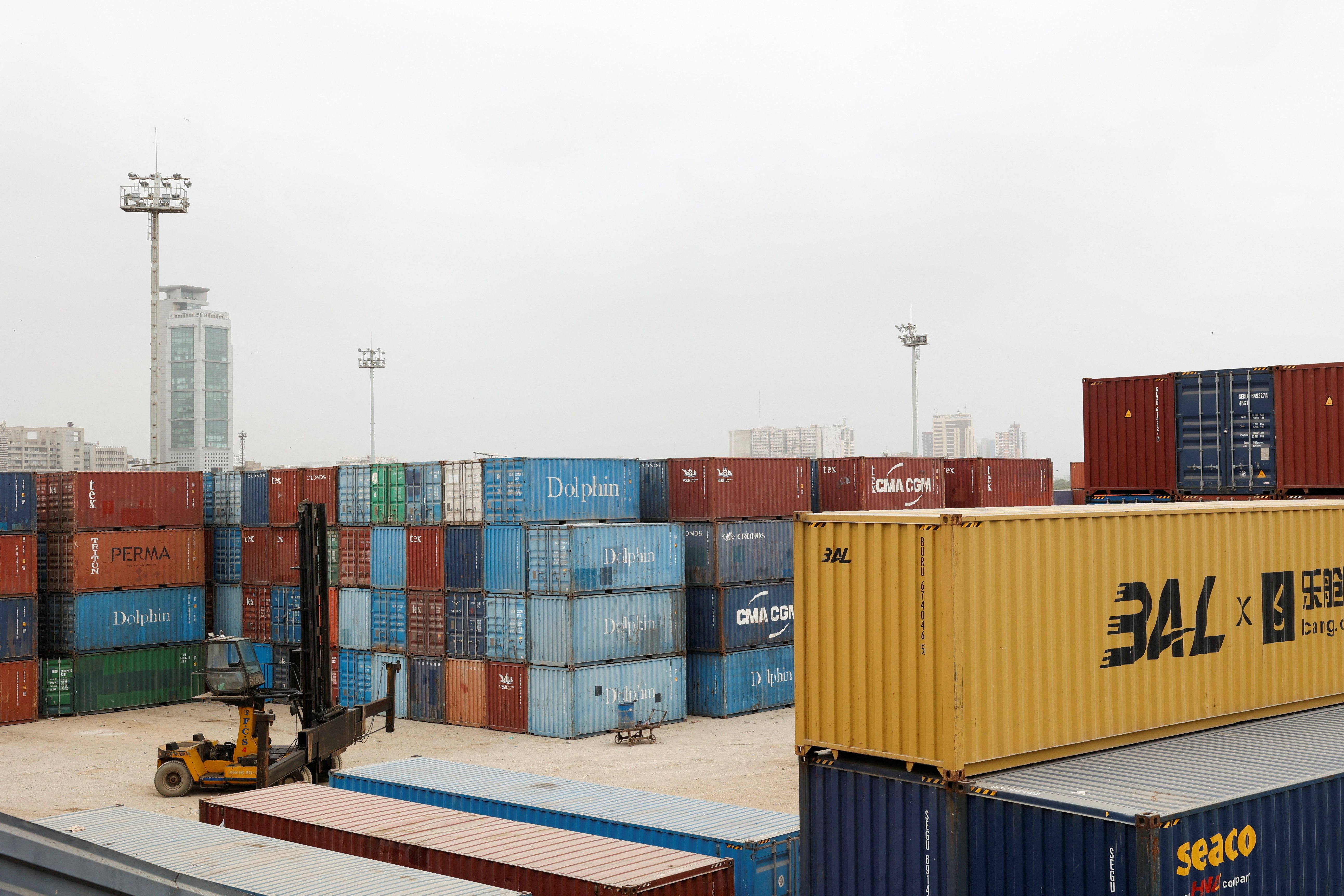 A view of shipping containers at a warehouse yard near the port area in Karachi.