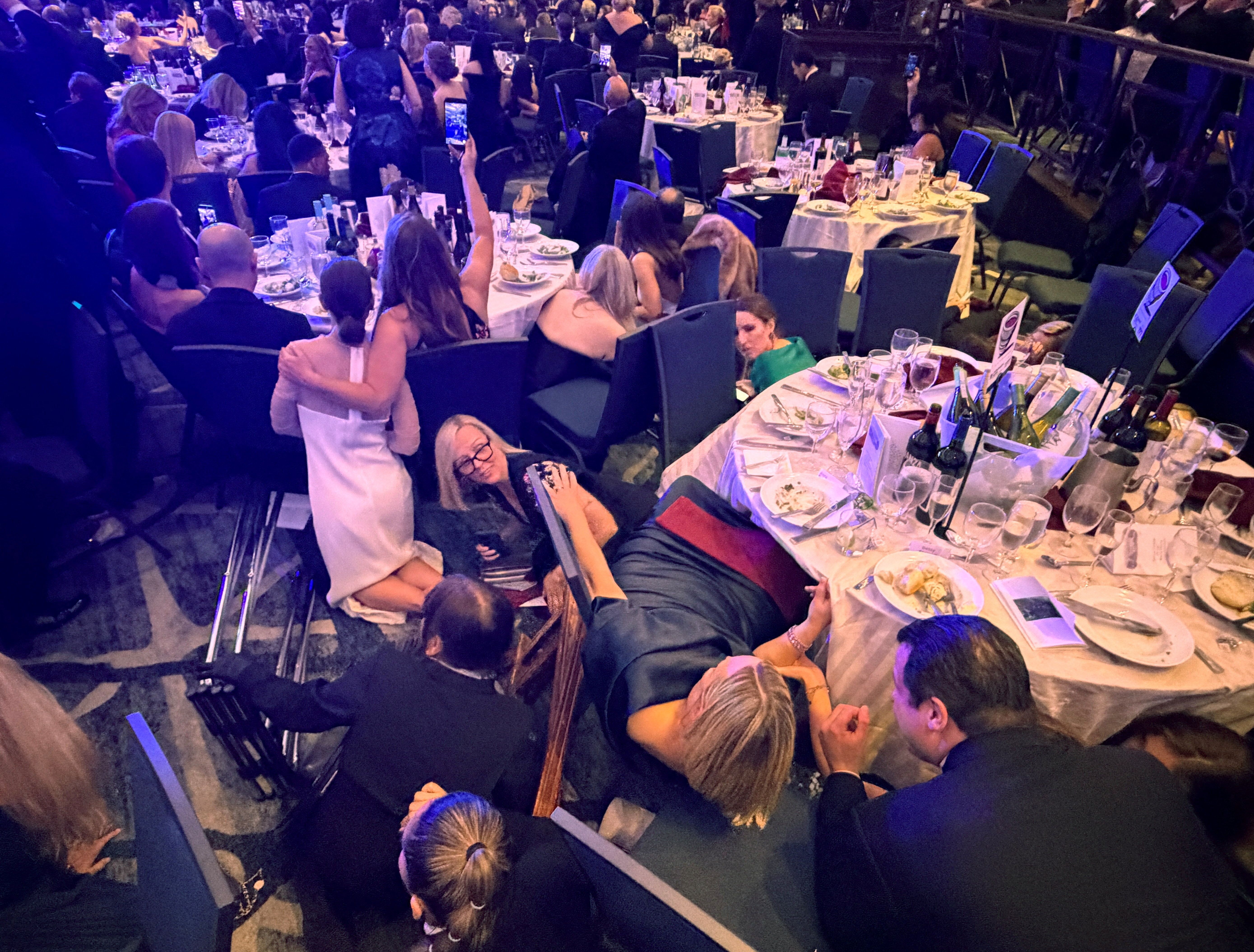 Guests take cover at the White House Correspondents’ Association dinner
