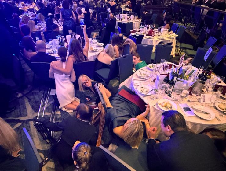 Guests take cover at the White House Correspondents’ Association dinner
