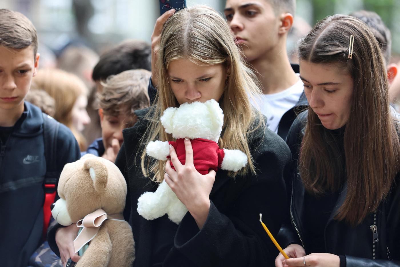 People react as they pay tribute following a school mass shooting, after a boy opened fire on others, killing fellow students and staff, in Belgrade, Serbia May 4, 2023. REUTERS/Zorana Jevtic