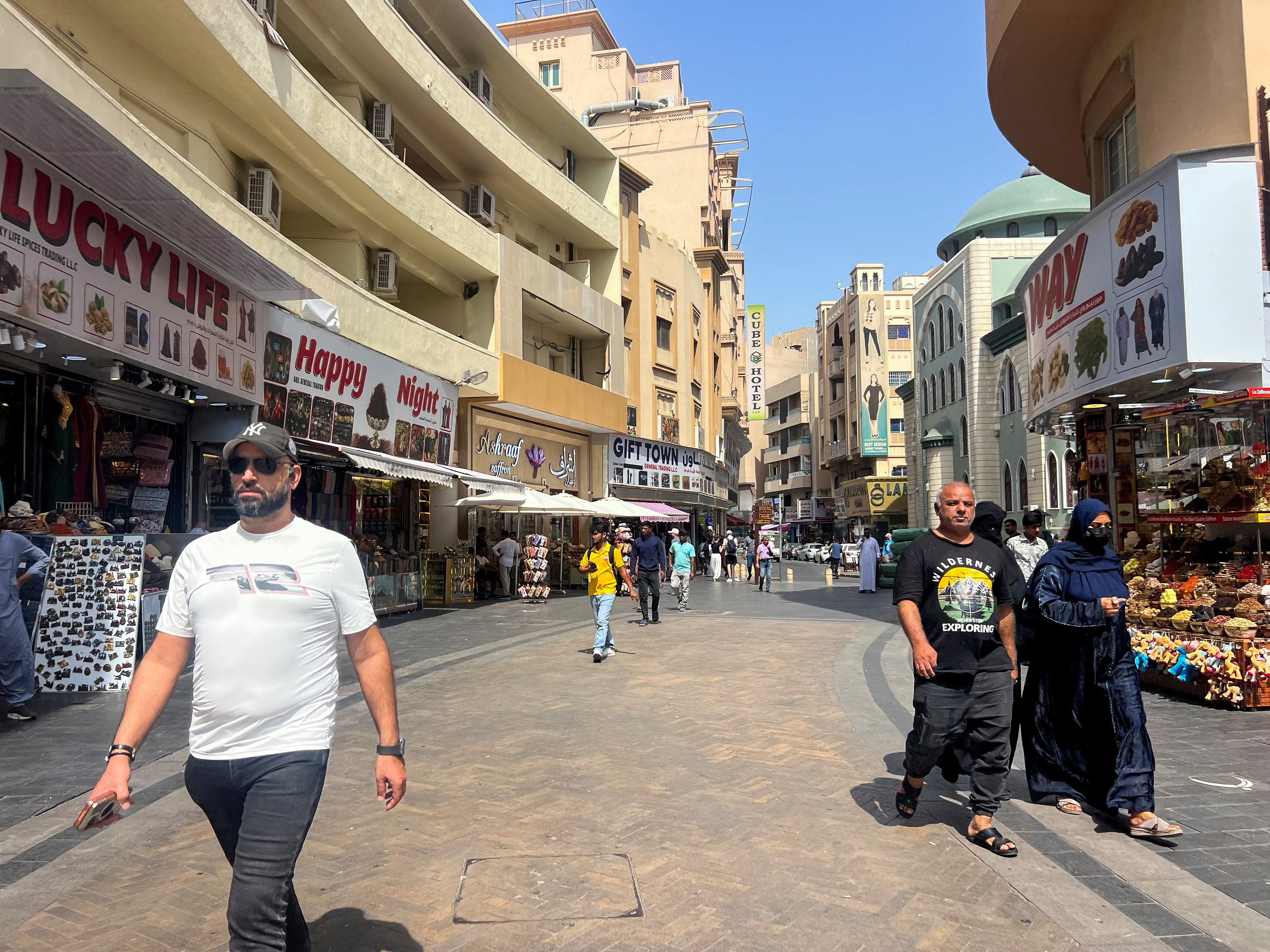 Pedestrians walk through the Iranian market in Dubai