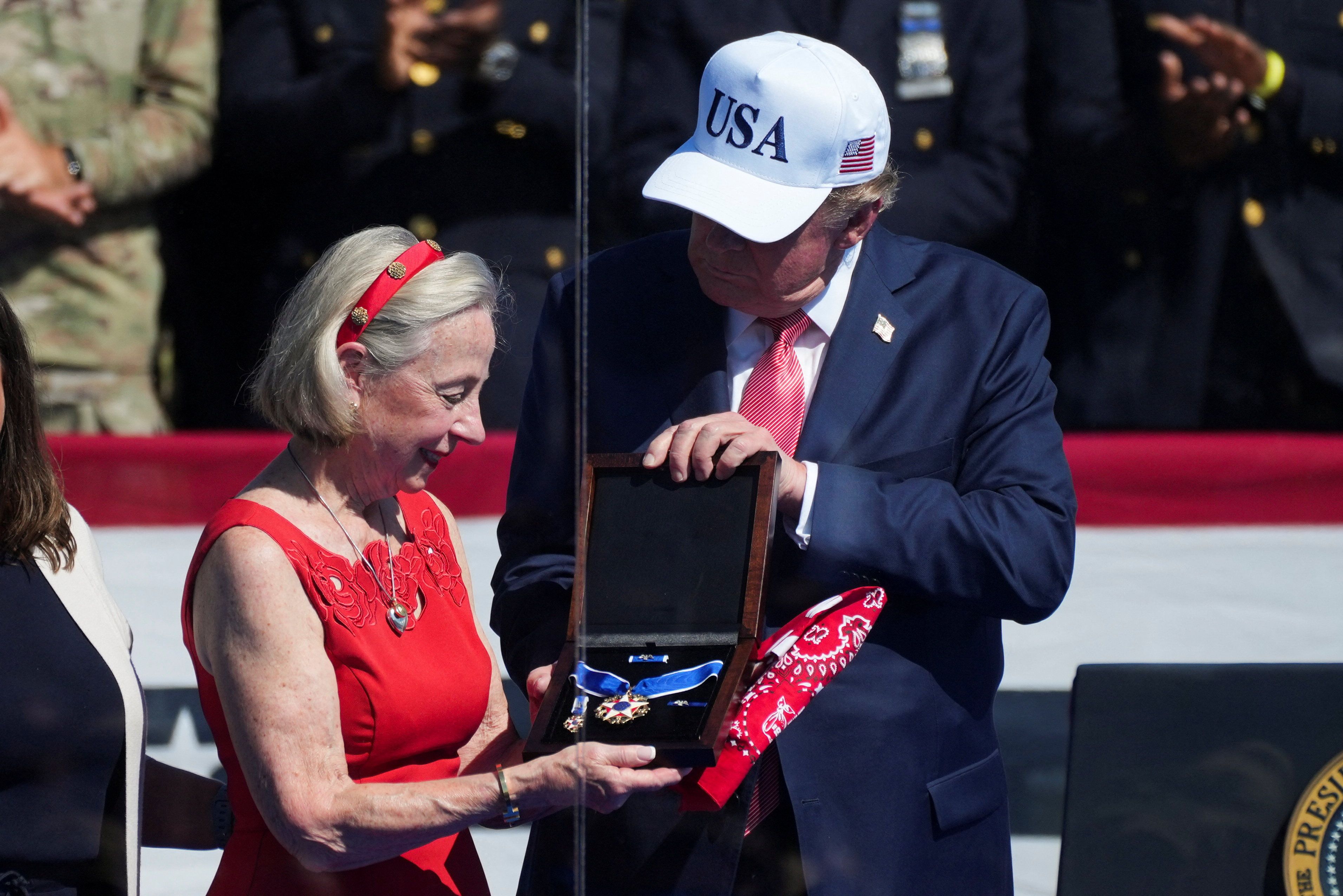 President Donald Trump presents the Presidential Medal of Freedom to Alison Crowther