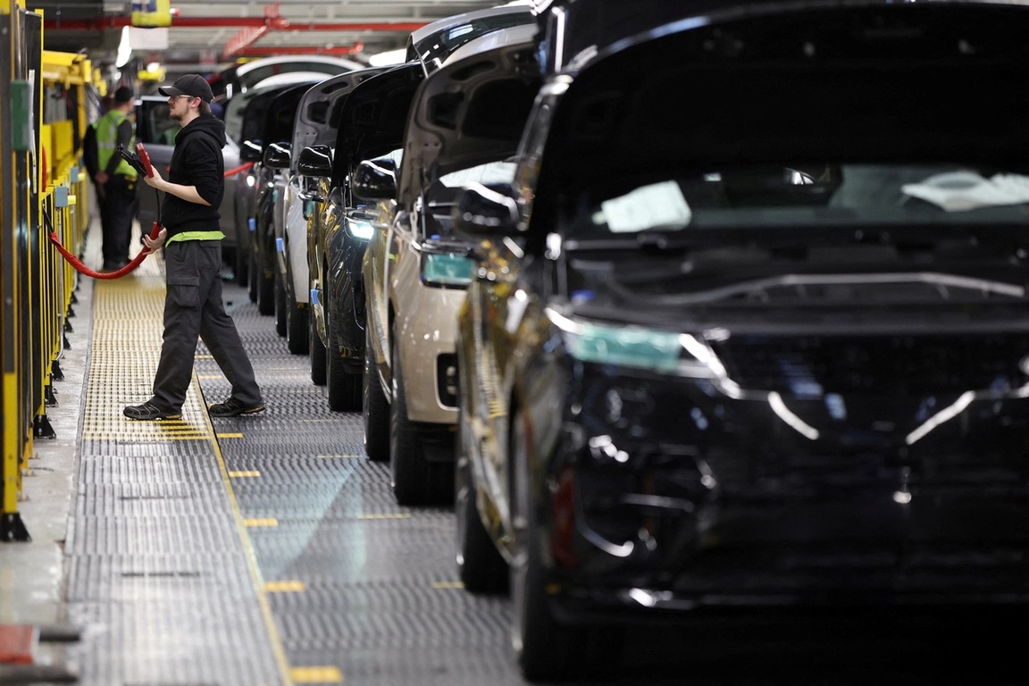 A member of staff works on the production line at Jaguar Land Rover’s factory in Solihull, Britain.
