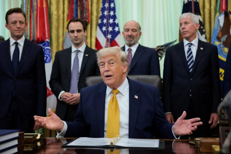 Trump signing the executive order.