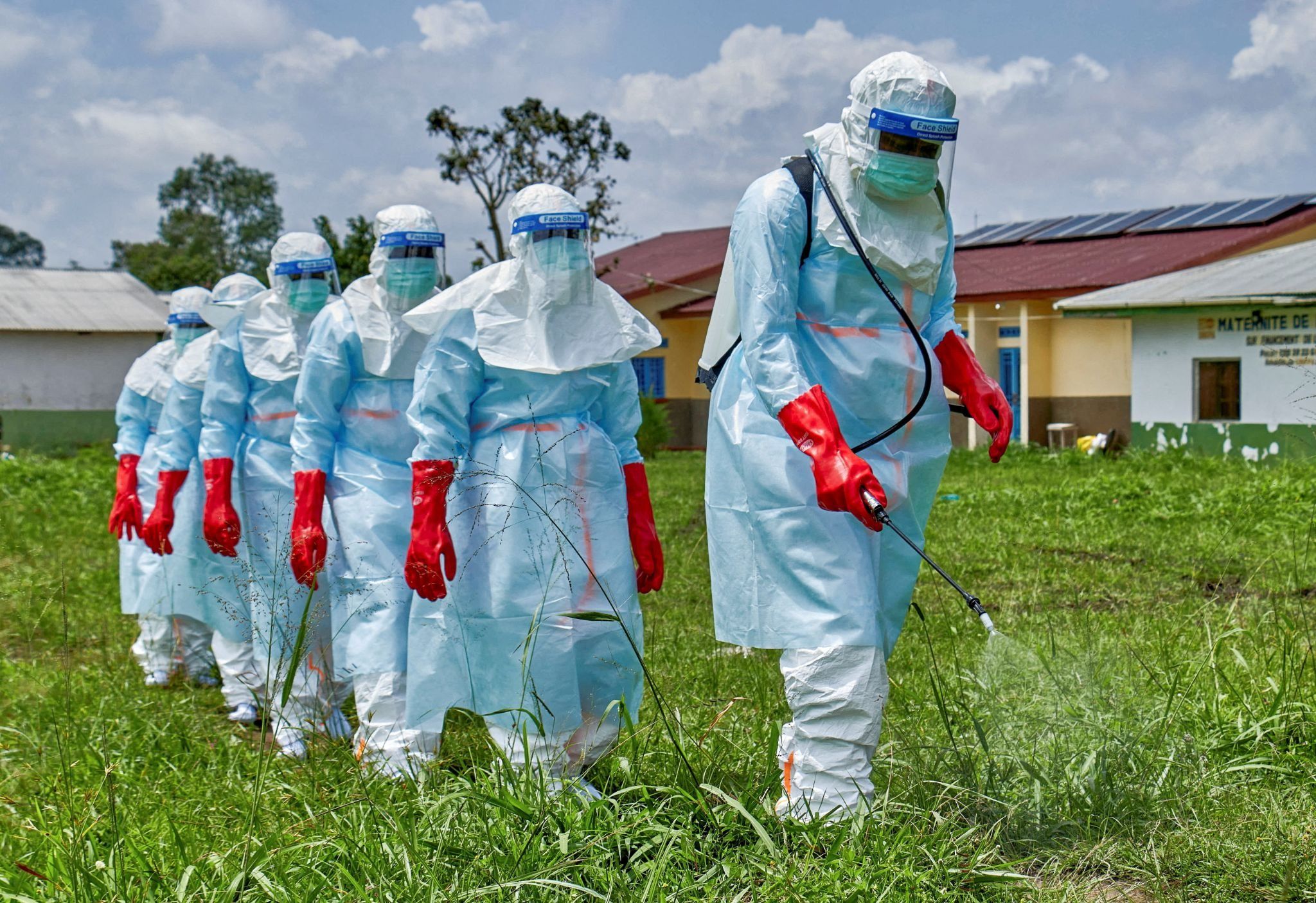 Red Cross workers disinfect Rwampara General Hospital in DR Congo.