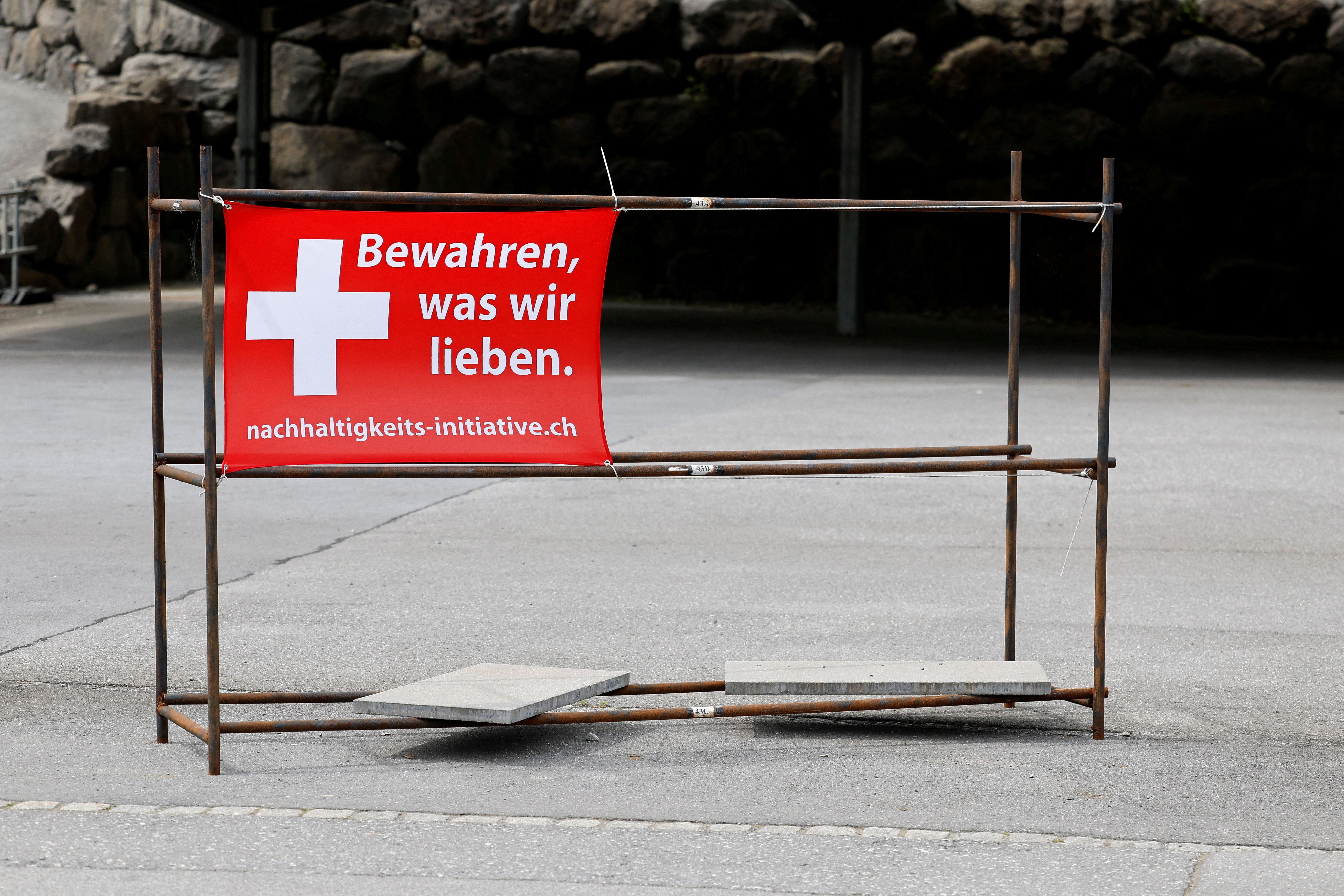 Sign is pictured ahead of a vote on a plan backed by the right-wing Swiss People’s Party to cap the population at 10 million inhabitants, in Glarus.