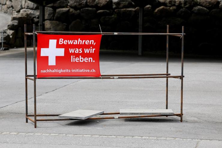 Sign is pictured ahead of a vote on a plan backed by the right-wing Swiss People’s Party to cap the population at 10 million inhabitants, in Glarus.