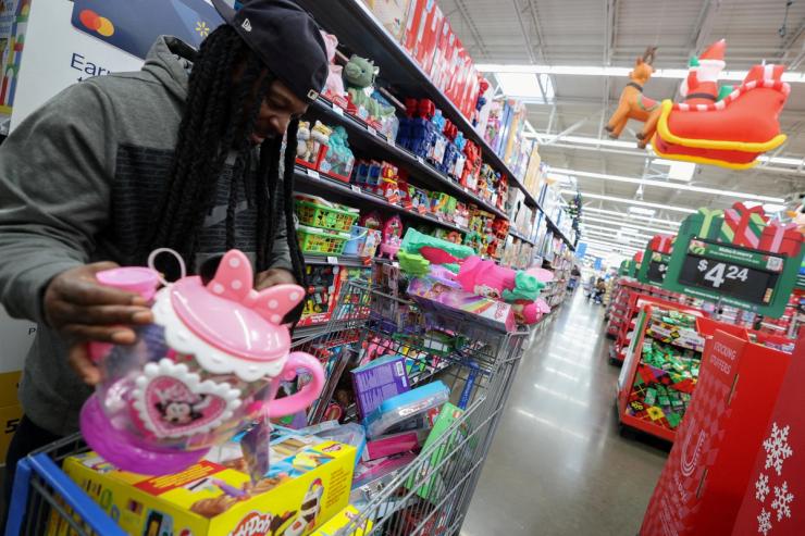 A customer shops for toys for holiday gifts at a Walmart