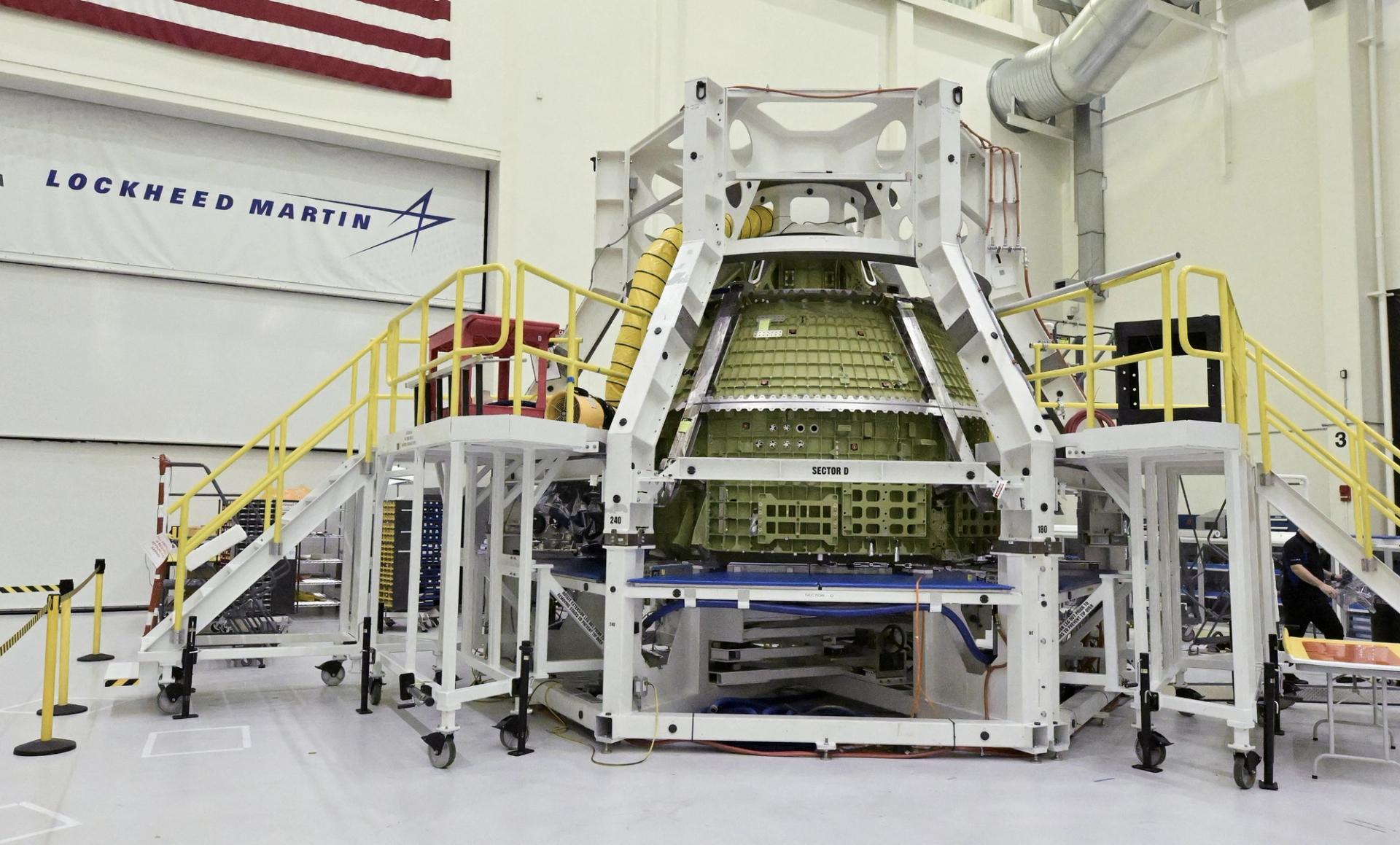 The Orion crew capsule for the Artemis IV moon mission is shown under construction at a NASA Artemis Media event at the Kennedy Space Center in Florida