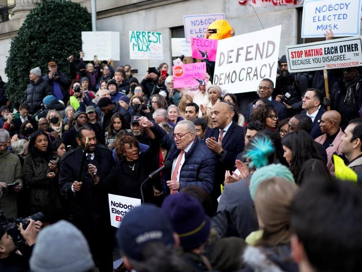 Chuck Schumer and other Democrats rally outside the Treasury Department