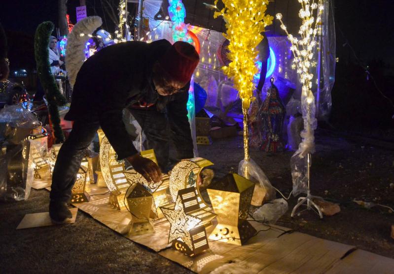 A vendor arranges decorations for the Muslim holy month of Ramadan in Amman, Jordan, March 22, 2023. REUTERS/Muath Freij