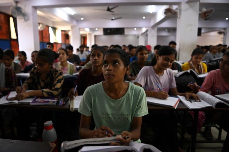 Students attend a class at Super Climax Academy, India.
