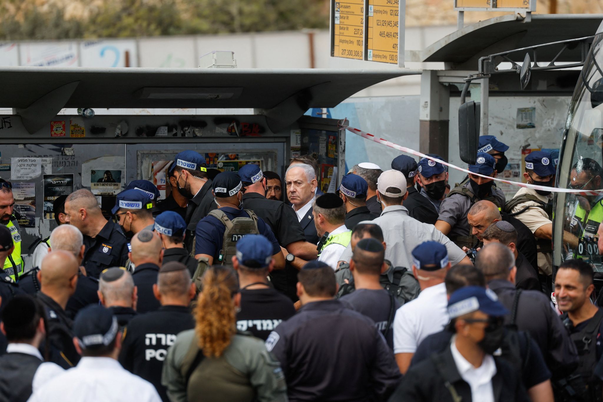 Israeli Prime Minister Benjamin Netanyahu looks on at the scene where a suspected shooting attack took place at the outskirts of Jerusalem.