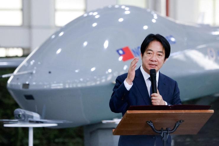 Taiwanese President Lai Ching-te speaking in front of a Teng Yun unmanned aerial vehicle