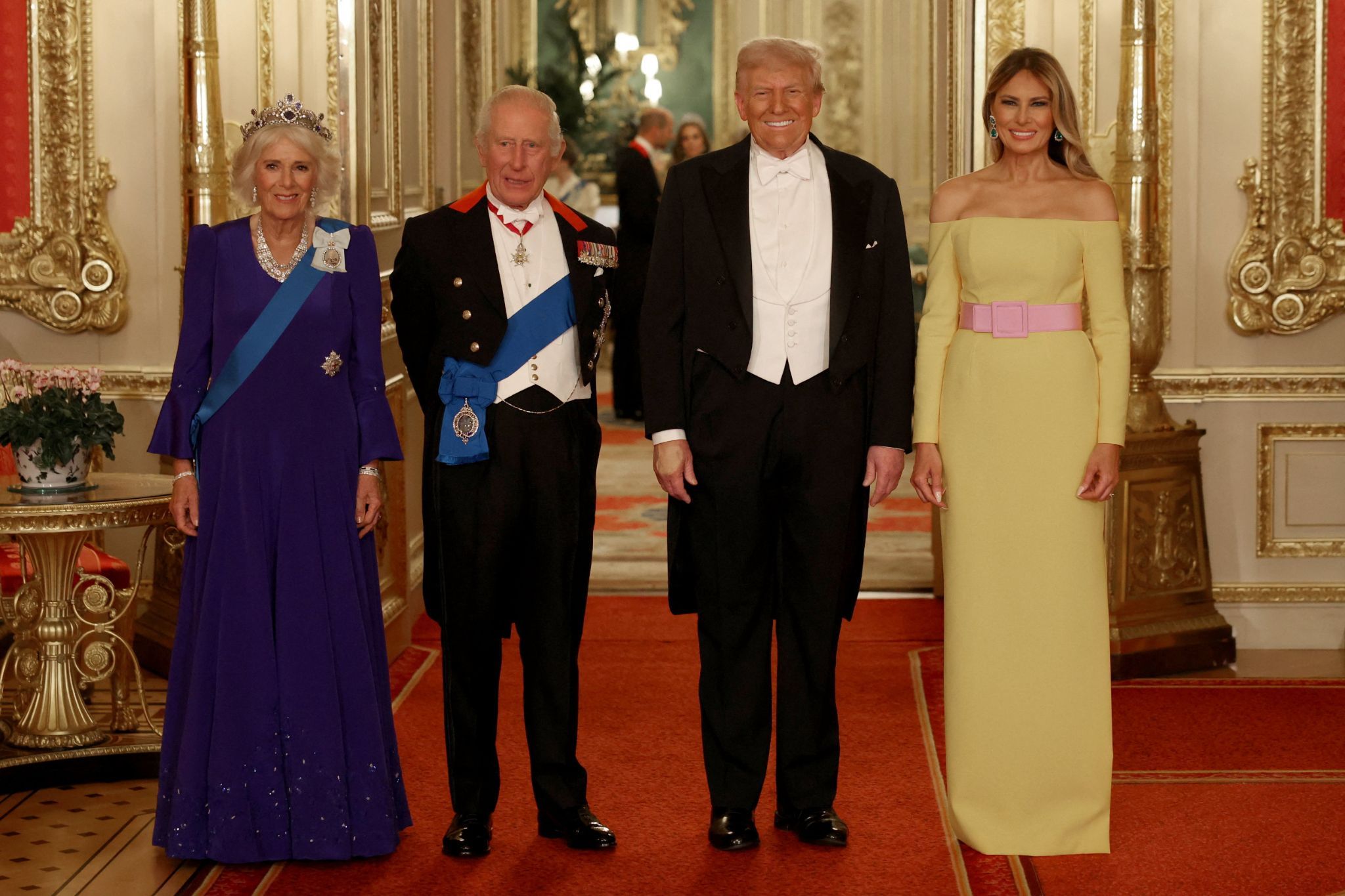 Britain’s Queen Camilla, King Charles, U.S. President Donald Trump and first lady Melania Trump pose for a family photo at the State Banquet.
