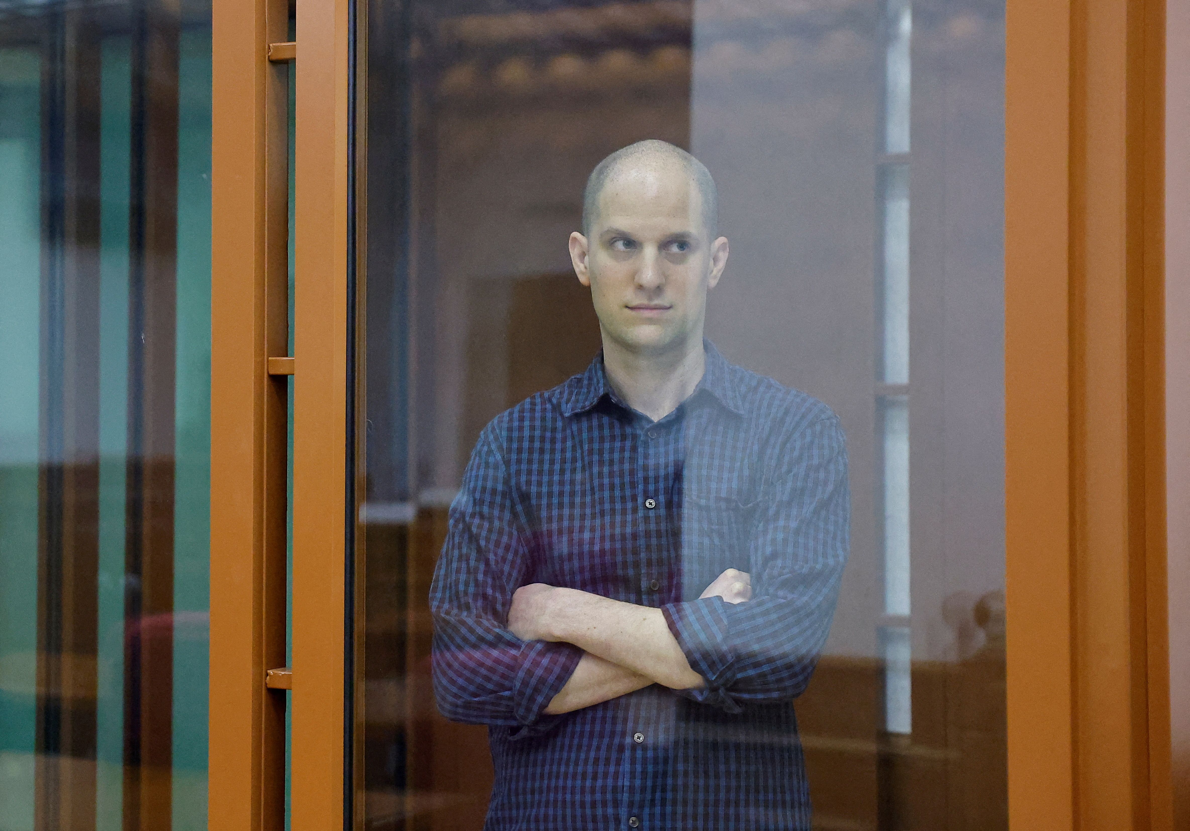 FILE PHOTO: Wall Street Journal reporter Evan Gershkovich, who stands trial on spying charges, is seen inside an enclosure for defendants before a court hearing in Yekaterinburg, Russia June 26, 2024. REUTERS/Evgenia Novozhenina/File Photo