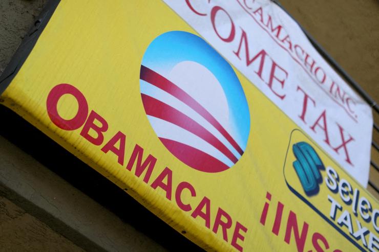 A sign with an ‘Obamacare’ logo