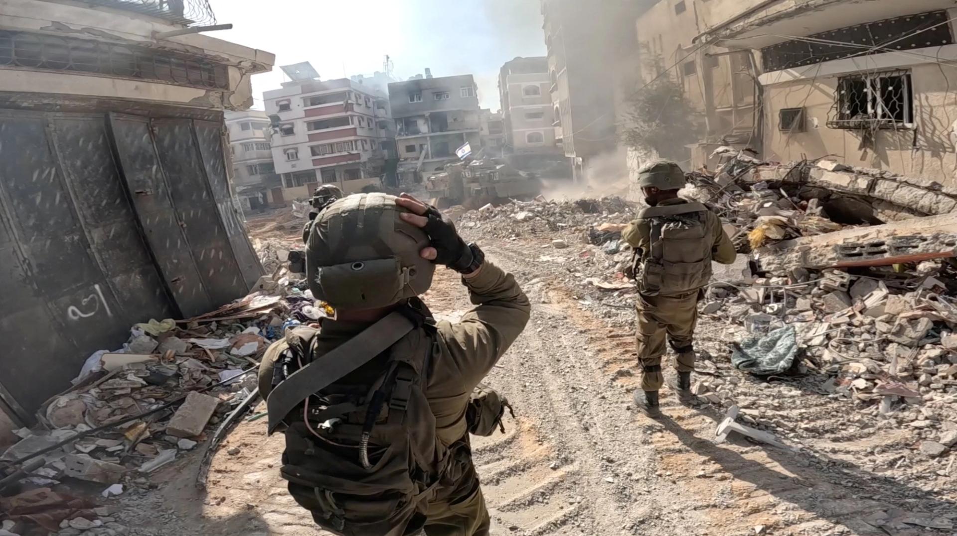 Israeli soldiers operate in the Gaza Strip amid the ongoing conflict between Israel and the Palestinian Islamist group Hamas, in this screen grab taken from a handout video released on December 4, 2023. Israel Defense Forces/Handout via REUTERS