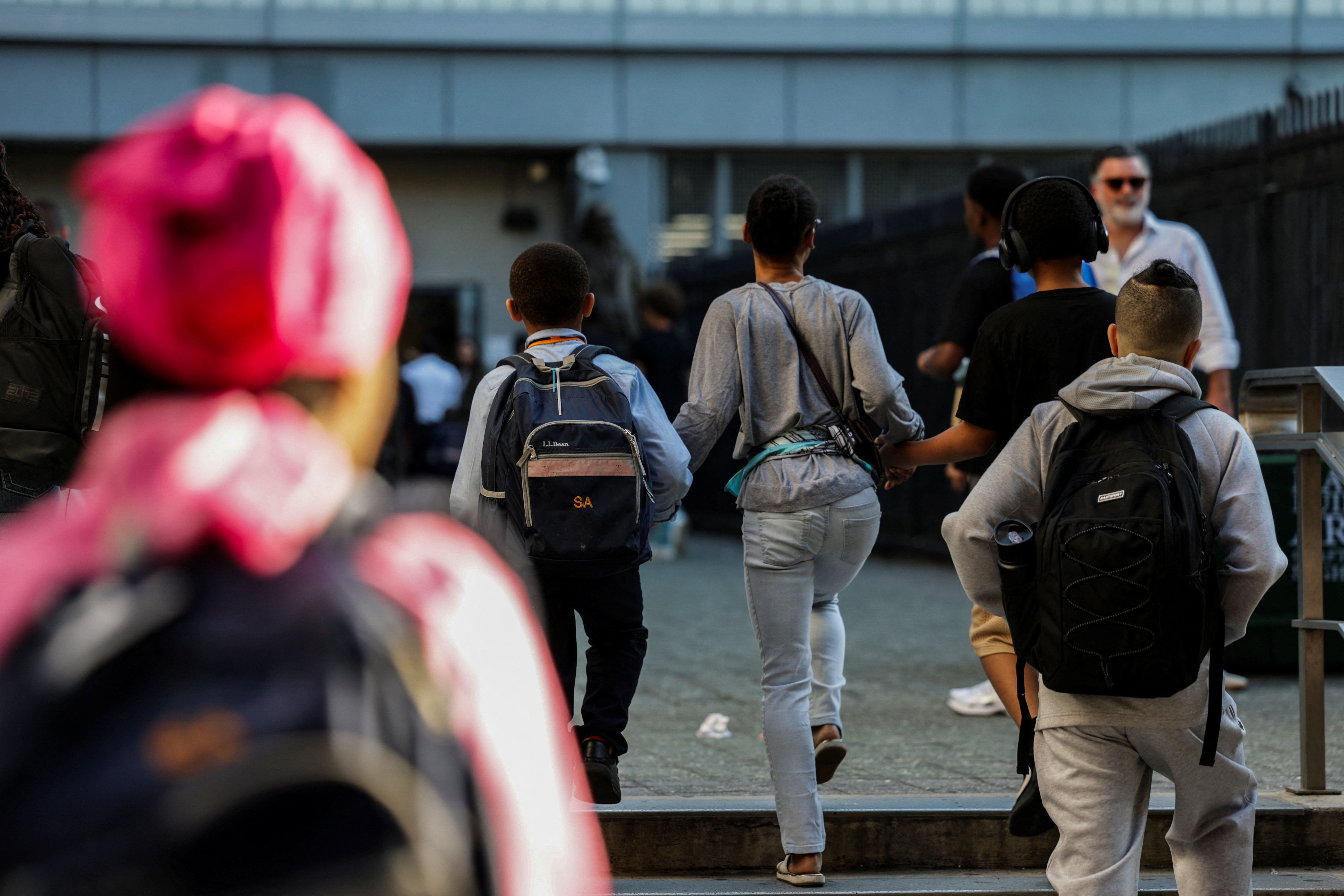 Children walk into a school in New York City