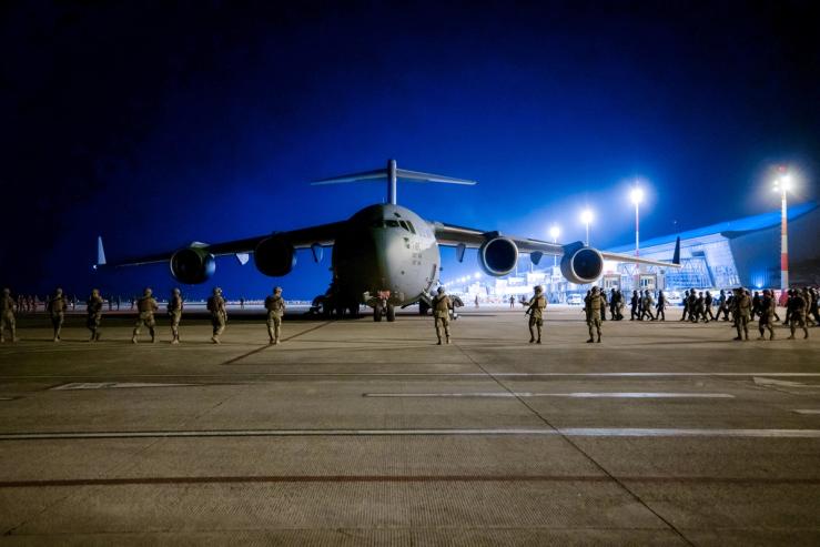 A deportation flight lands in El Salvador.