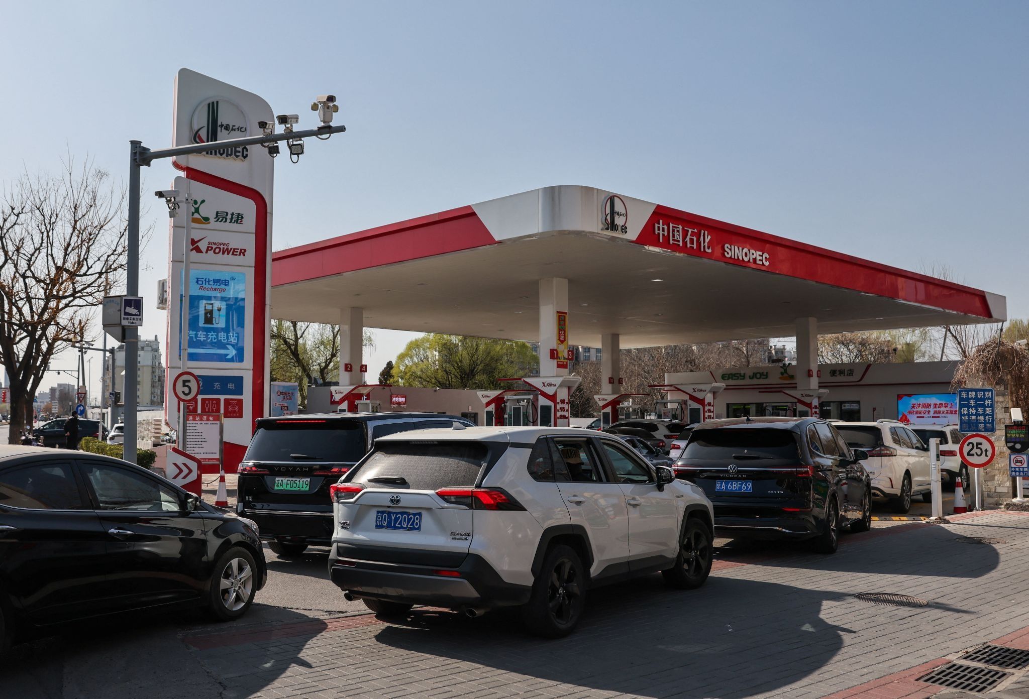 Drivers queue at a Sinopec gas station