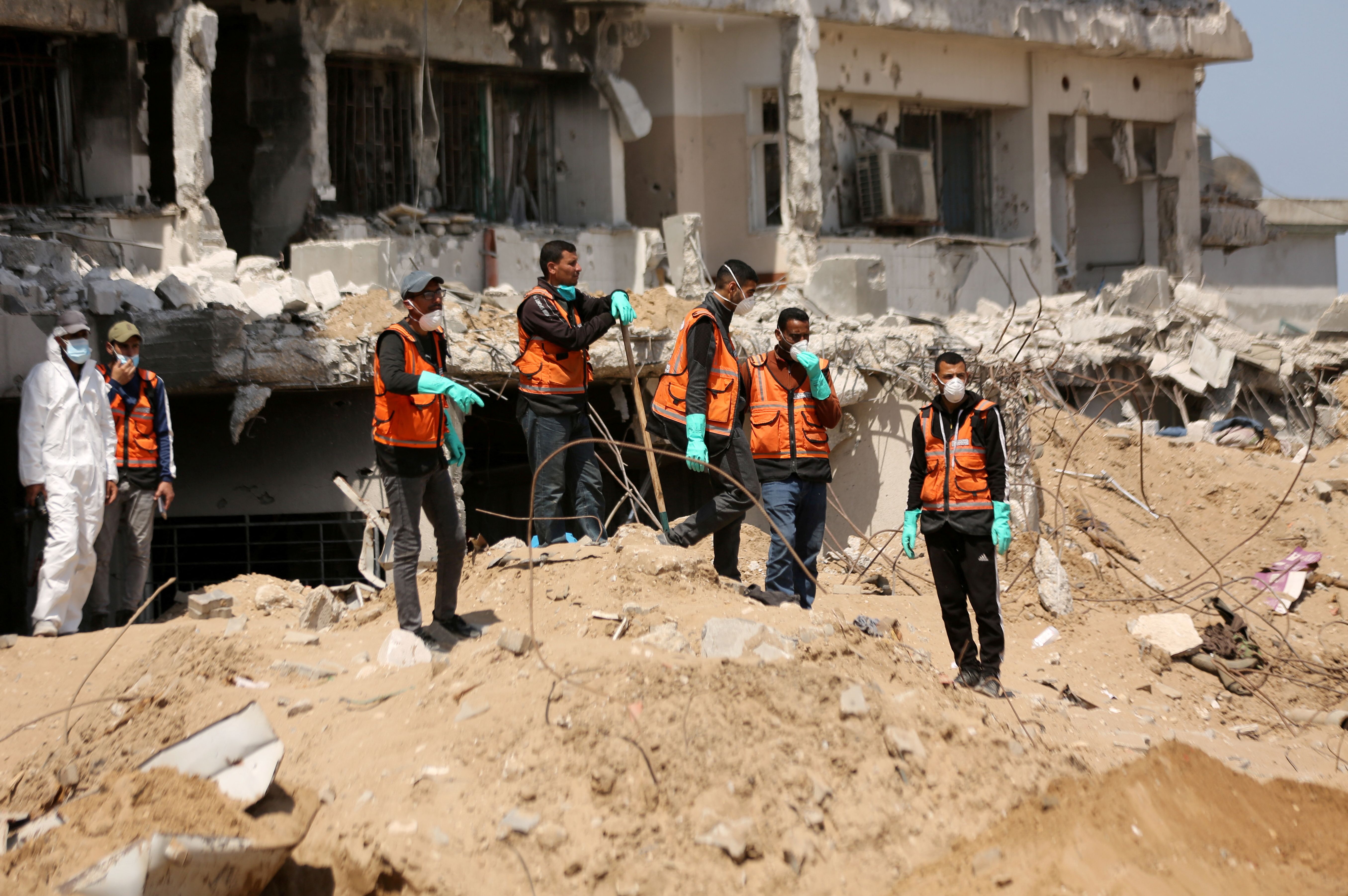 Rescuers and medics search for dead bodies inside the damaged Al Shifa Hospital after Israeli forces withdrew from the hospital and the area around it following a two-week operation, amid the ongoing conflict between Israel and Hamas, in Gaza City April 8, 2024. REUTERS/Dawoud Abu Alkas